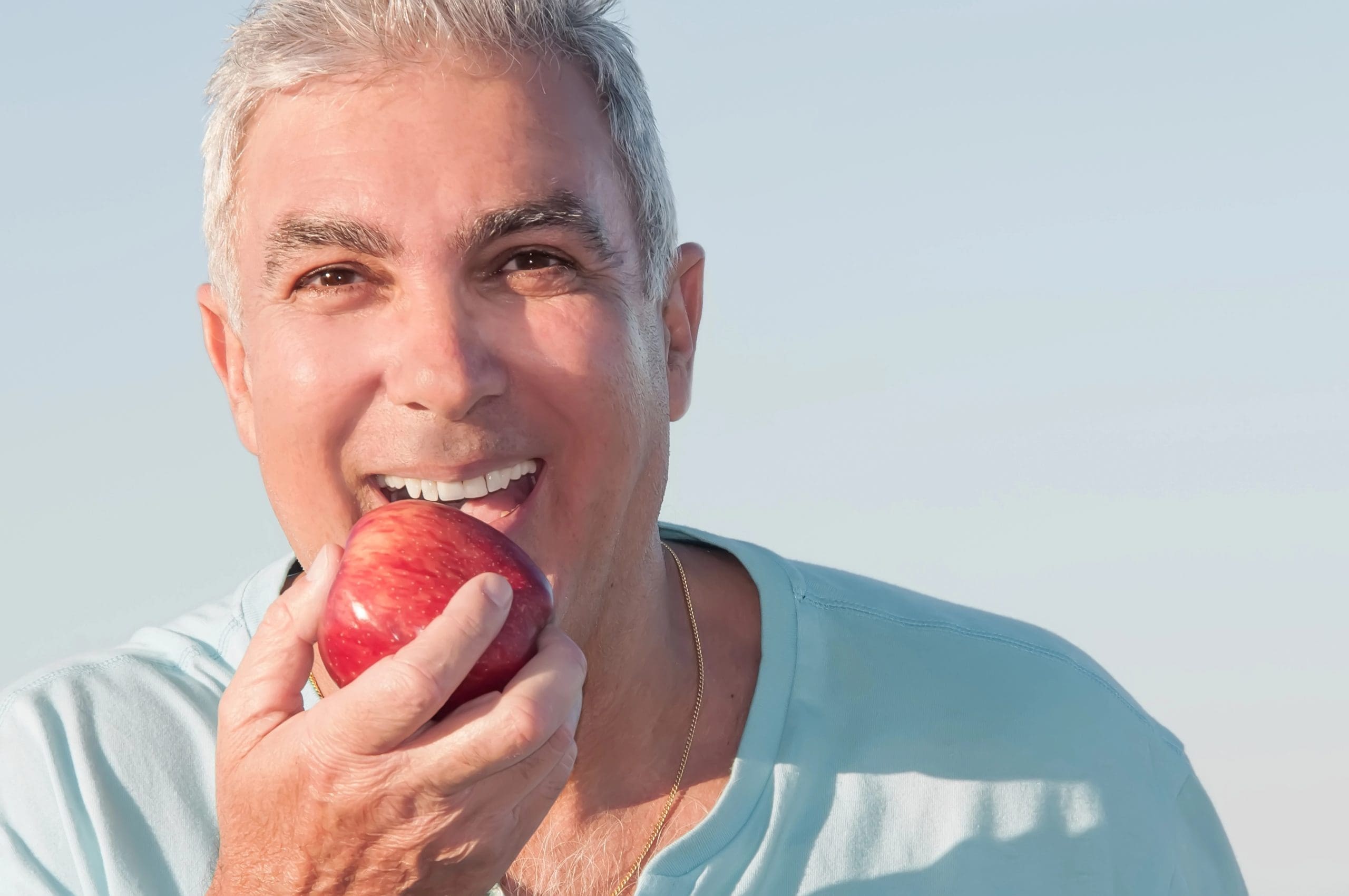 Dentures vs Implants: Pros and Cons in 2024